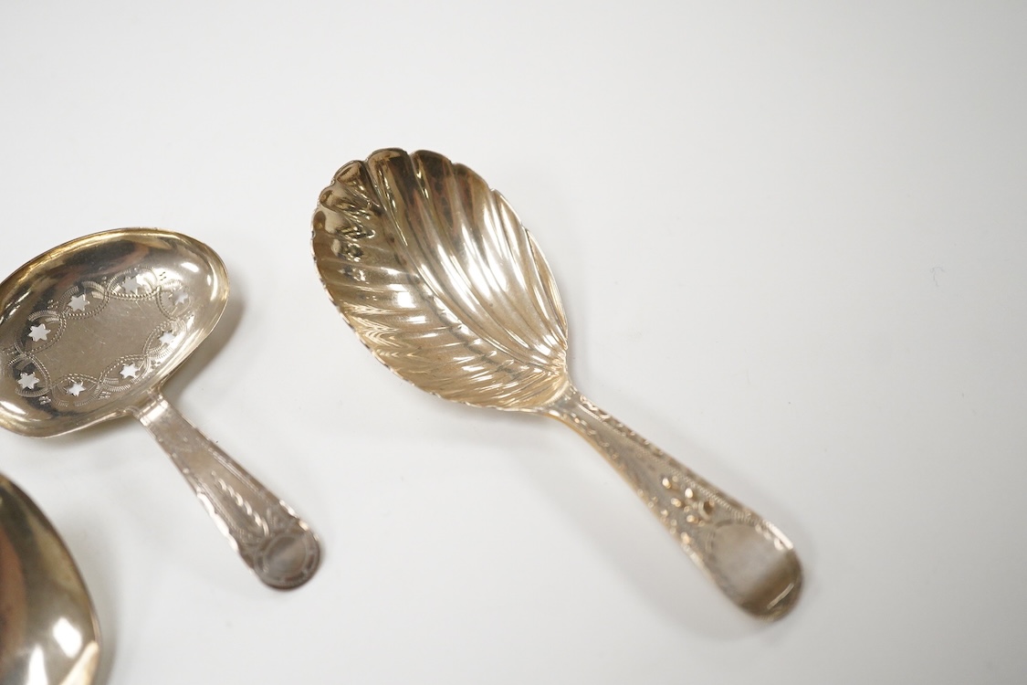 Three assorted silver caddy spoons, including star cut bowl by John Thropp, Birmingham, 1817, 69mm, hourglass? pattern, Joseph Wilmore, marks rubbed, bright cut engraved handle London, 1856 and a filigree white metal spo